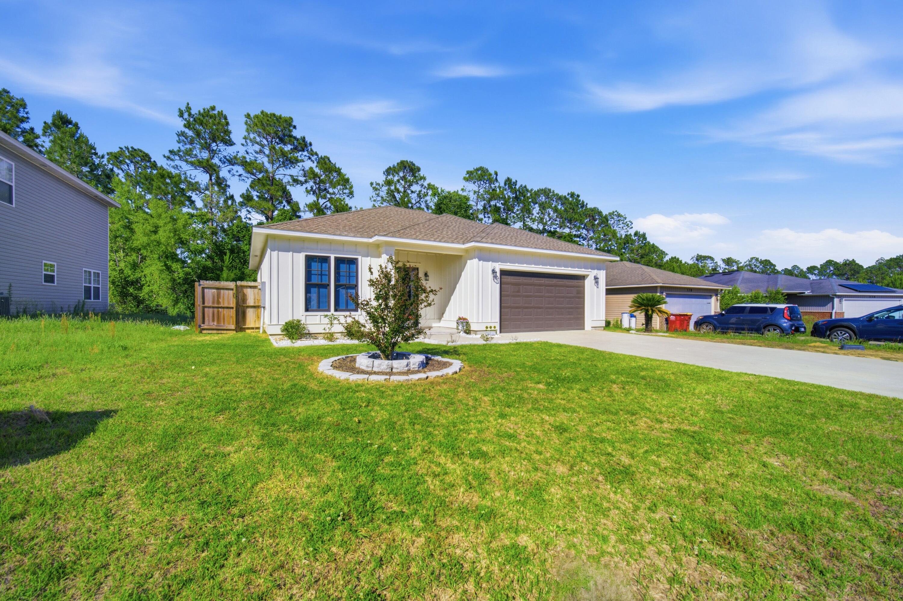 120 Lillian Way Crestview, FL 32536 - Photo 3 of 67 a front view of house with yard and outdoor seating