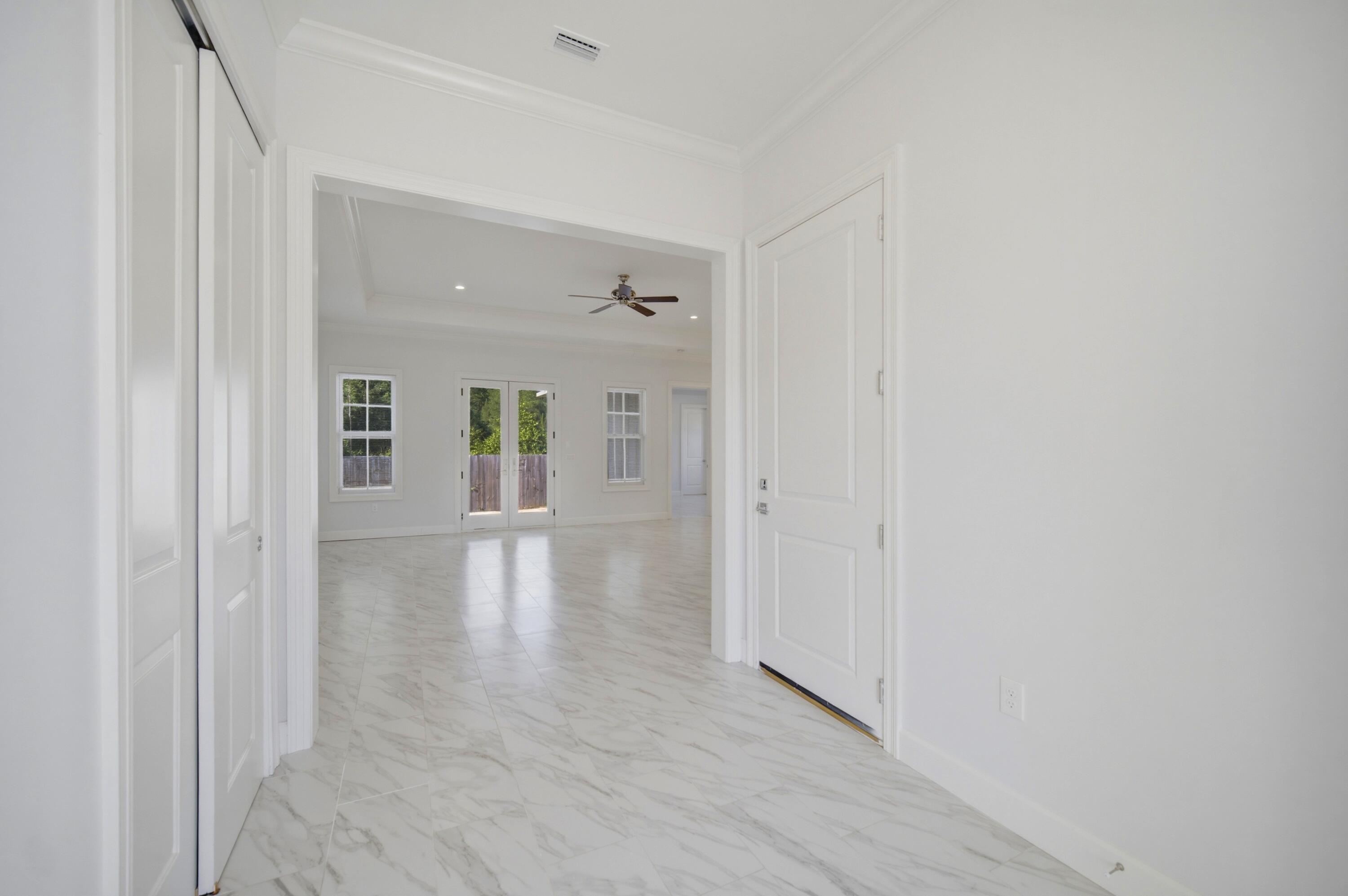 120 Lillian Way Crestview, FL 32536 - Photo 32 of 67 a view of empty room with wooden floor