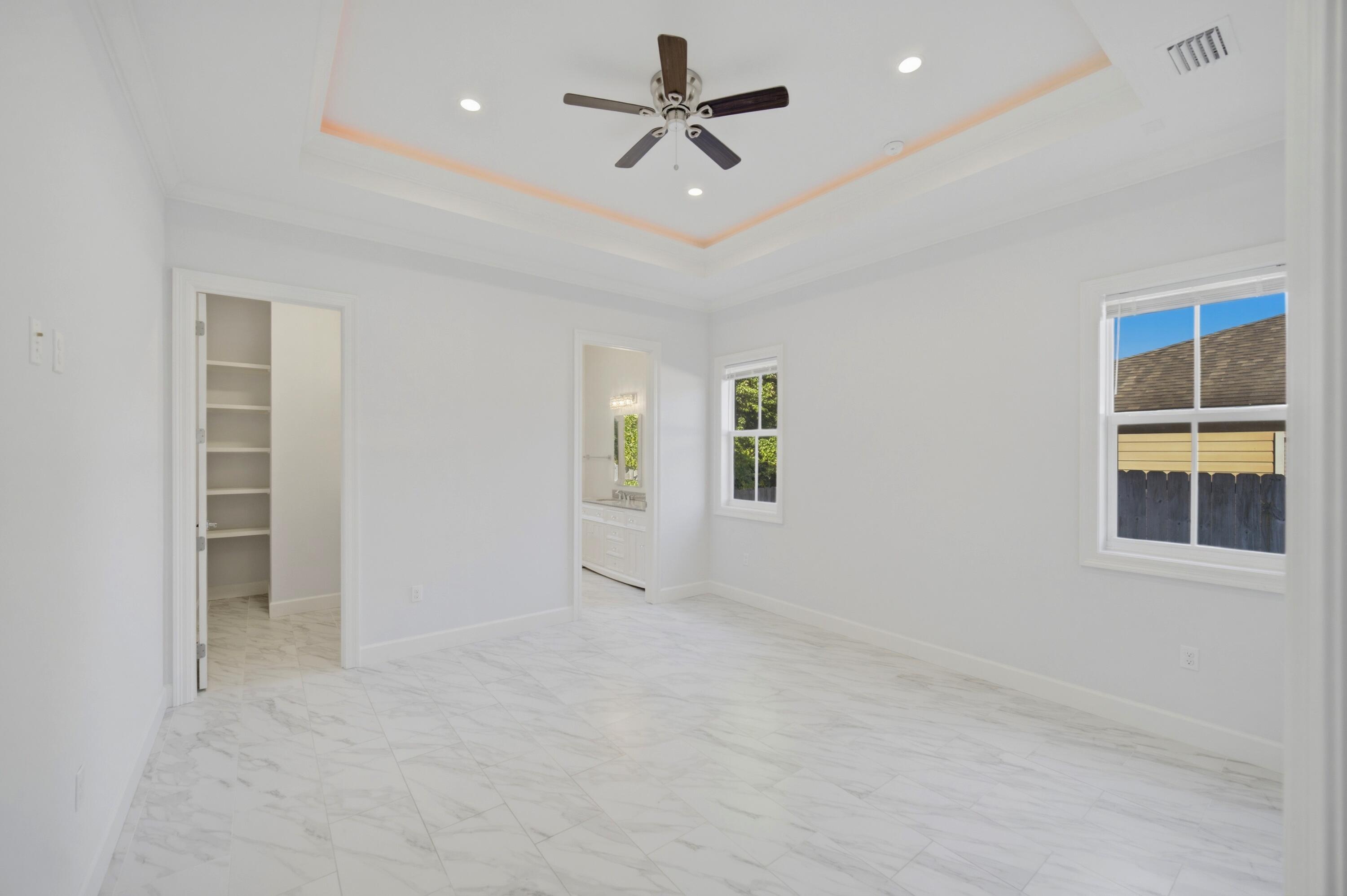 120 Lillian Way Crestview, FL 32536 - Photo 50 of 67 an empty room with windows and fan