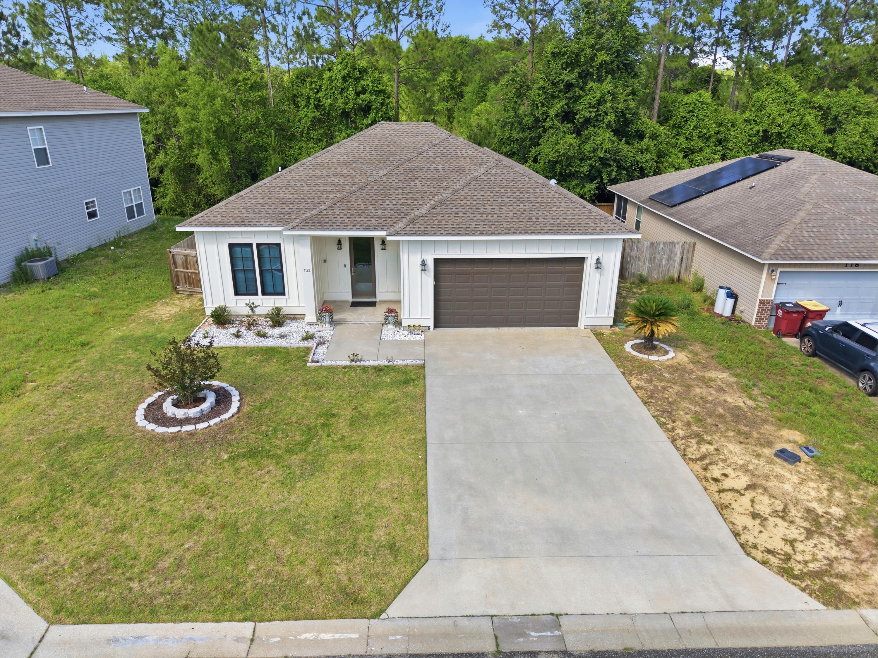 120 Lillian Way Crestview, FL 32536 - Photo 7 of 67 a view of a house with backyard and garden