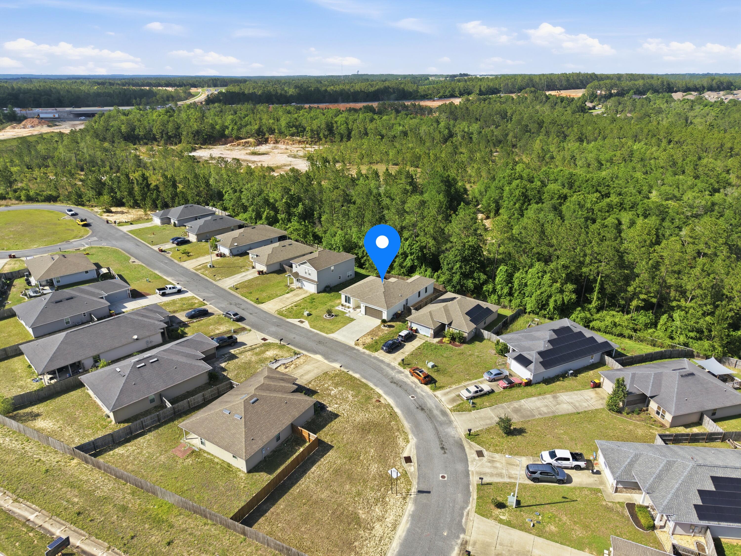 120 Lillian Way Crestview, FL 32536 - Photo 10 of 67 an aerial view of a house with outdoor space swimming pool and lake view
