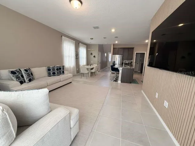 a living room with furniture and a couch