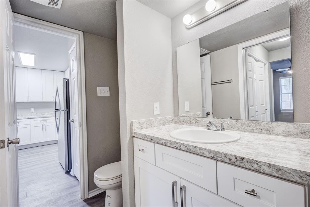 6108 Abrams Road, Unit 503 Dallas, TX 75231 - Photo 10 of 21 a bathroom with a granite countertop sink toilet and shower