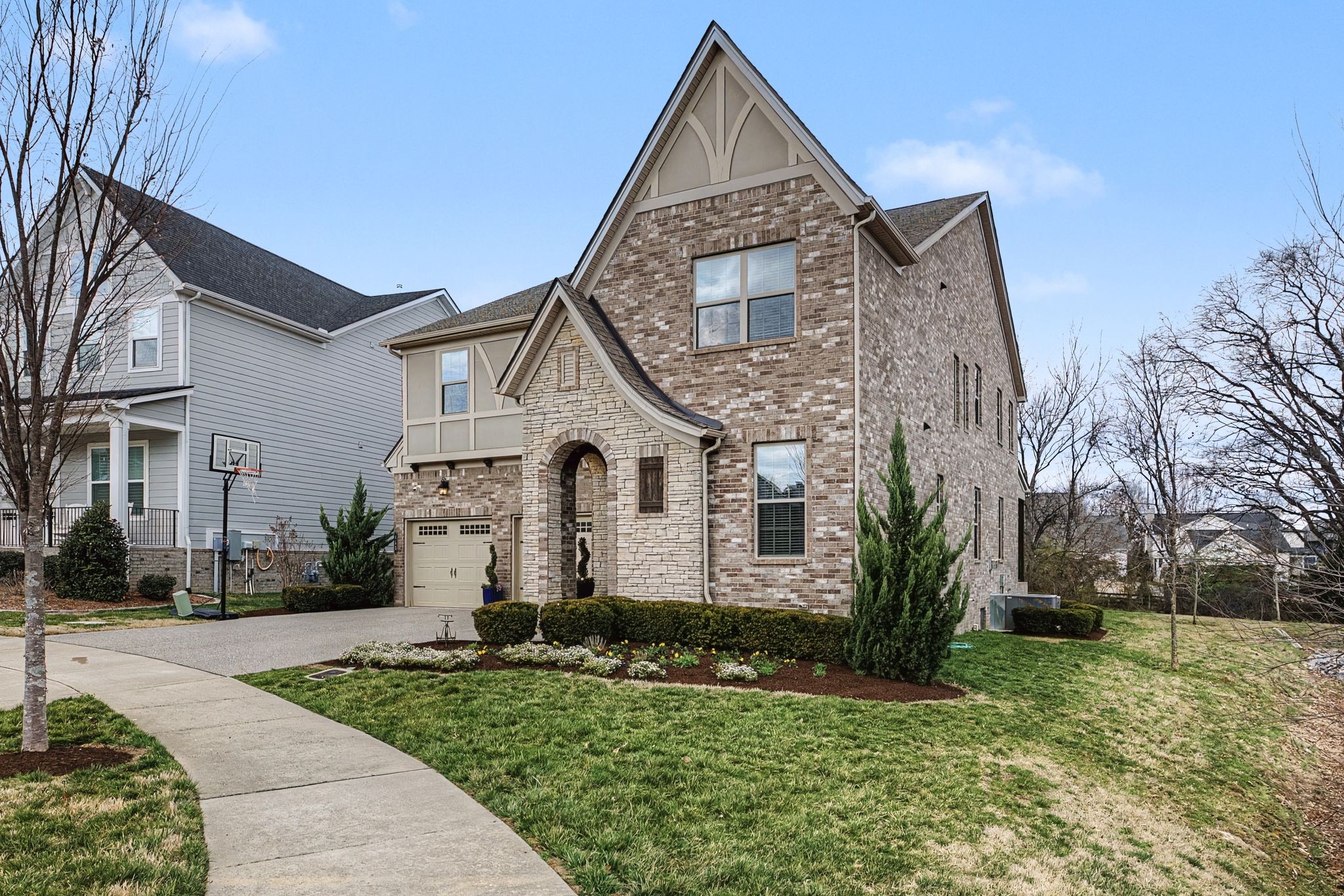 455 Cardel Lane Franklin, TN 37064 - Photo 1 of 54 a front view of a house with a yard