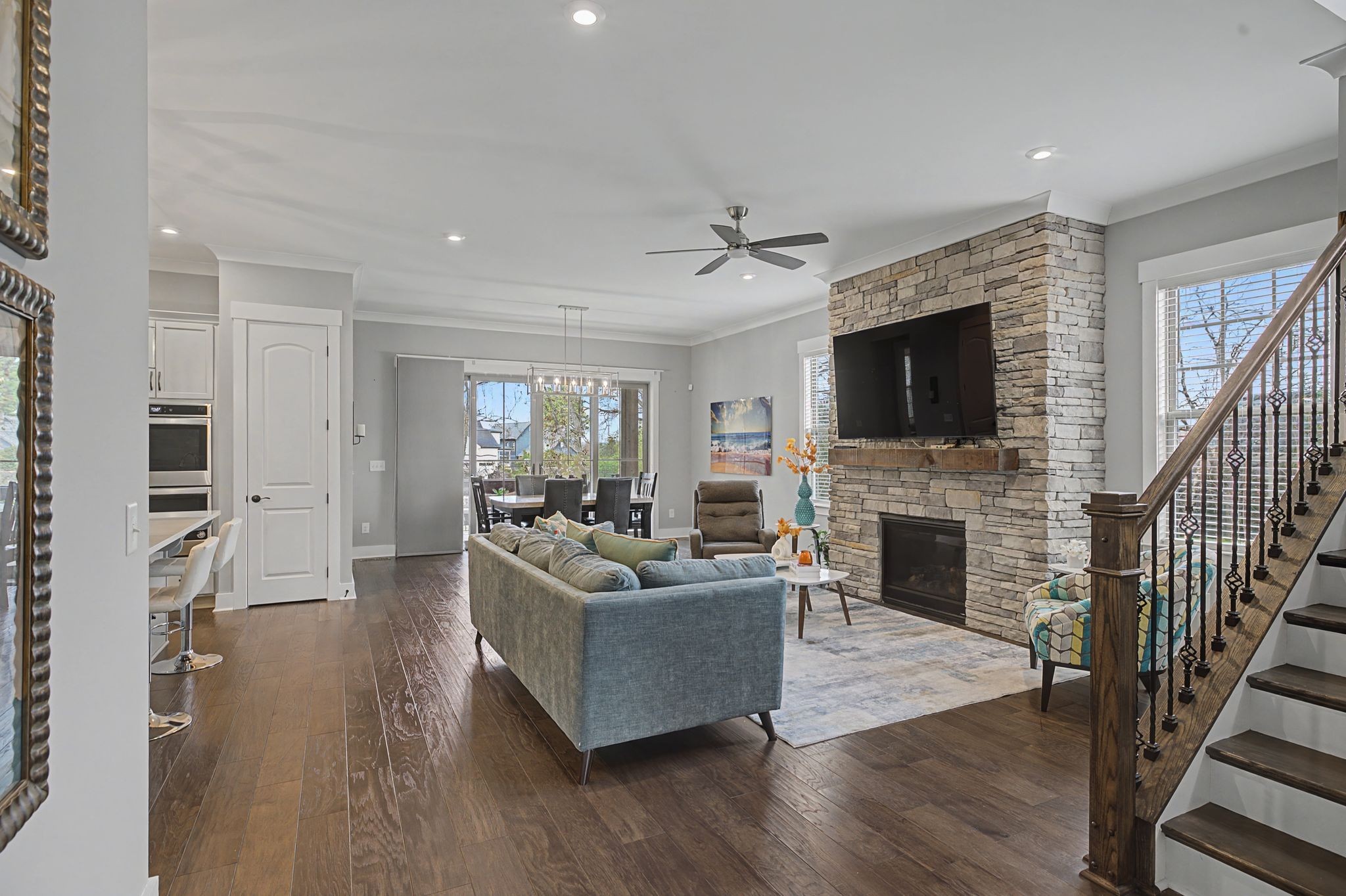 455 Cardel Lane Franklin, TN 37064 - Photo 13 of 54 a living room with furniture a fireplace and a flat screen tv