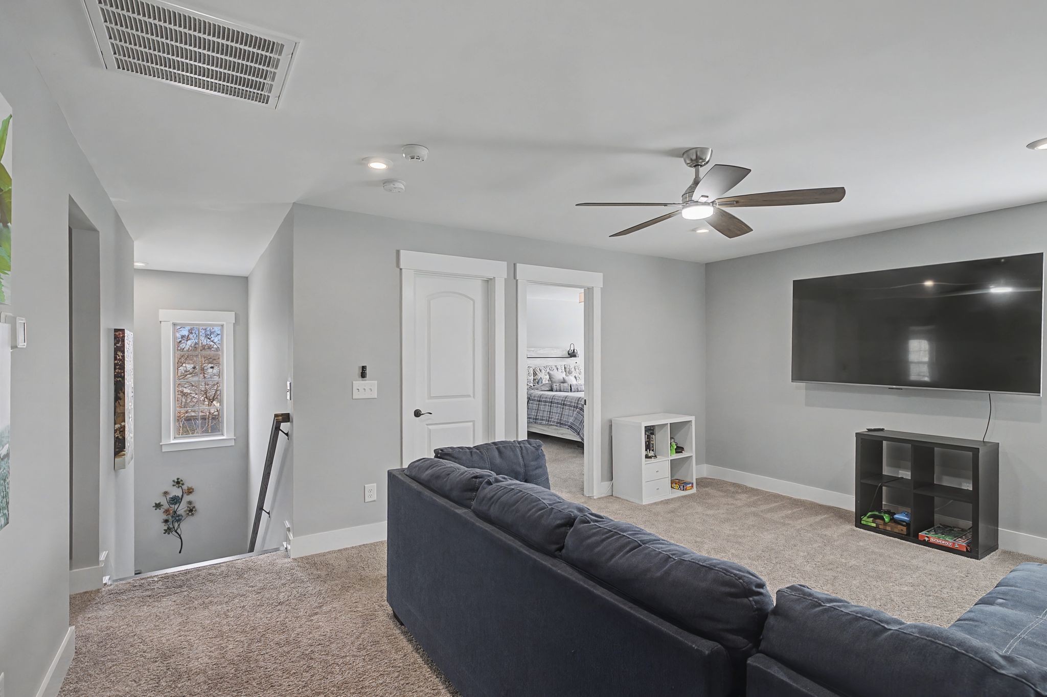 455 Cardel Lane Franklin, TN 37064 - Photo 30 of 54 a living room with furniture and a flat screen tv