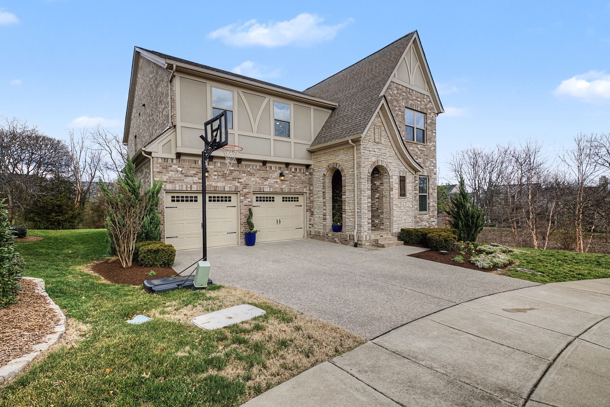 455 Cardel Lane Franklin, TN 37064 - Photo 3 of 54 a front view of a house with a yard