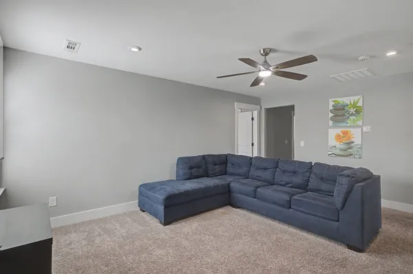 a en suite bathroom with a sink and mirror