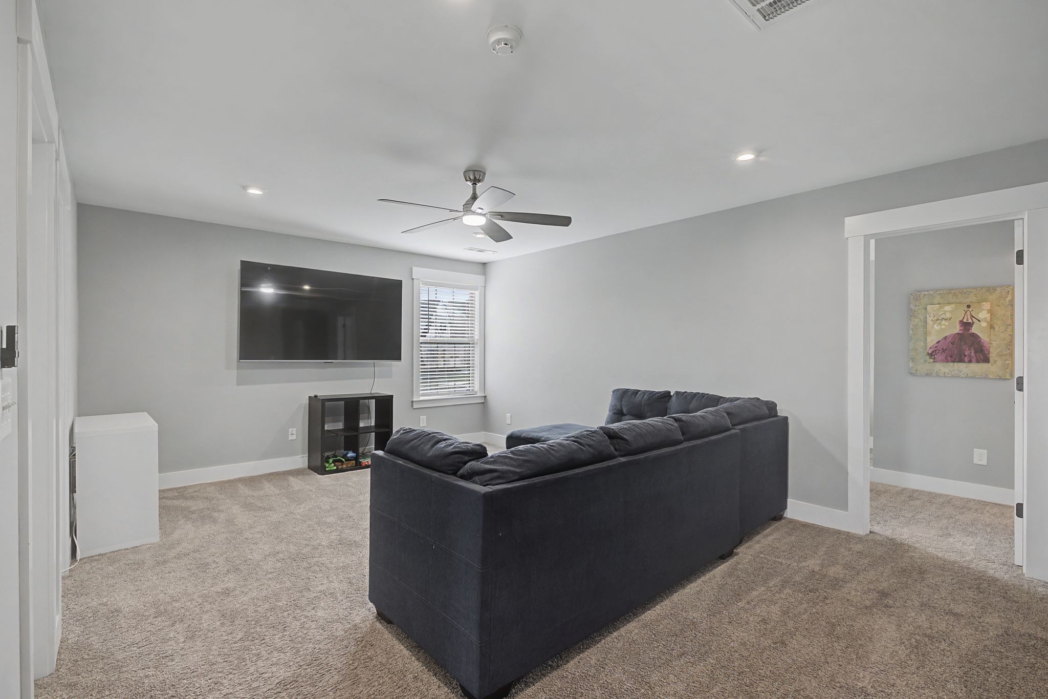 455 Cardel Lane Franklin, TN 37064 - Photo 32 of 54 a living room with furniture and a flat screen tv
