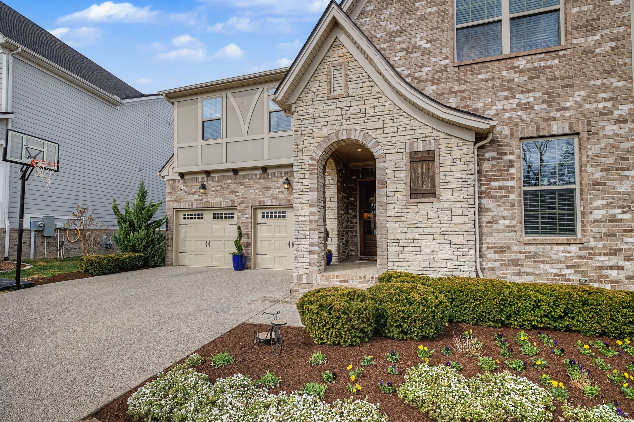 455 Cardel Lane Franklin, TN 37064 - Photo 4 of 54 a front view of a house with a garden