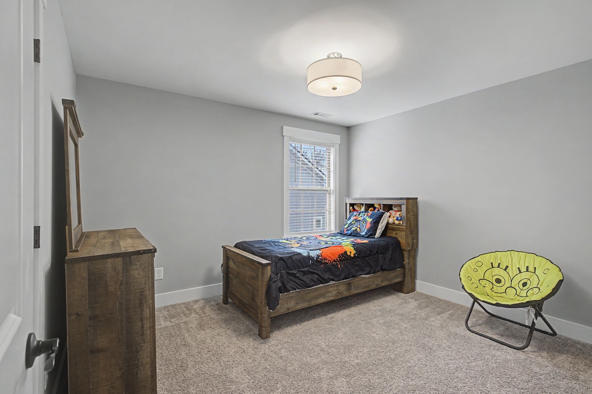 455 Cardel Lane Franklin, TN 37064 - Photo 41 of 54 a bedroom with a bed and a chandelier