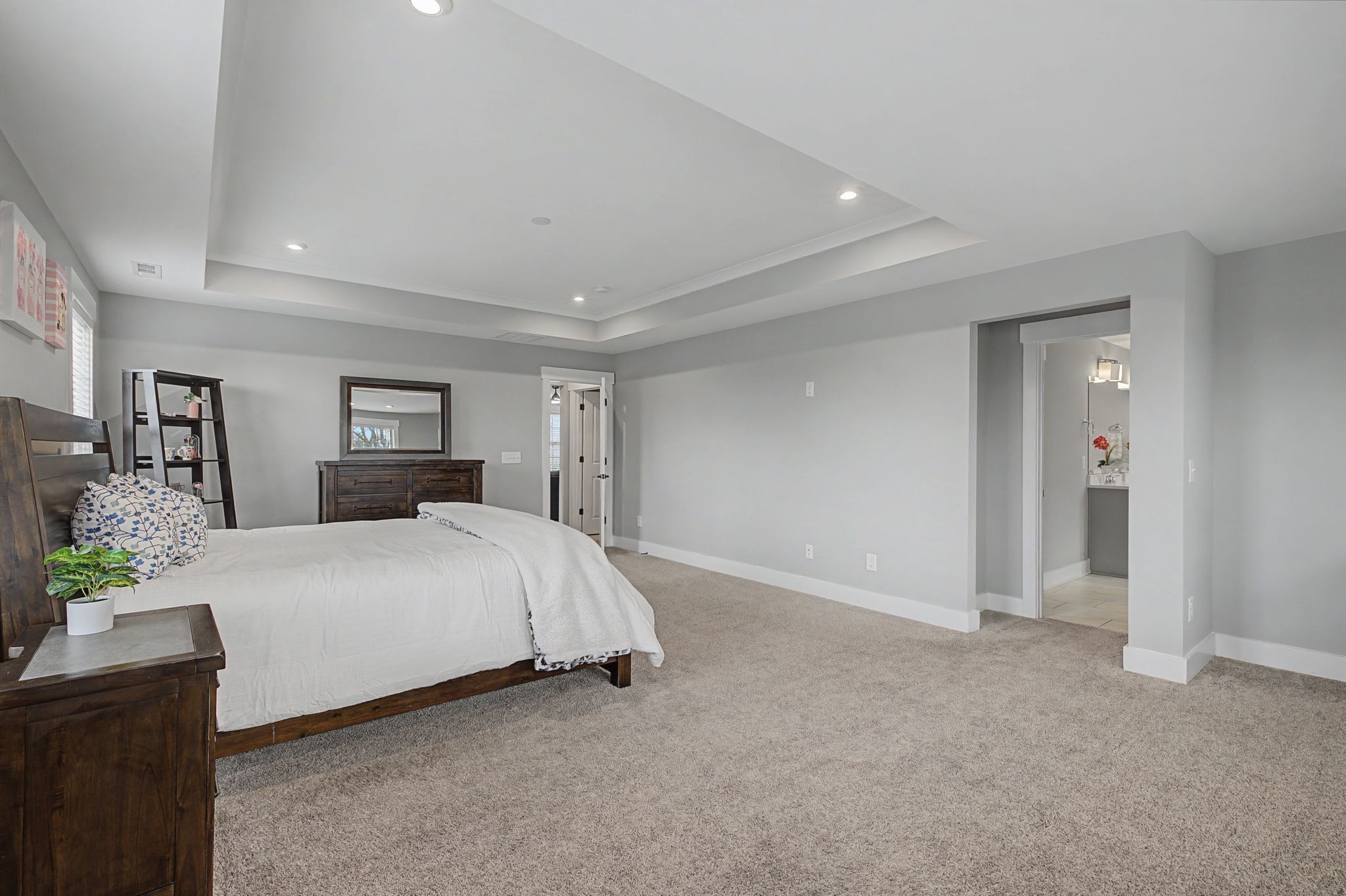 455 Cardel Lane Franklin, TN 37064 - Photo 43 of 54 a spacious bedroom with a bed and a dresser