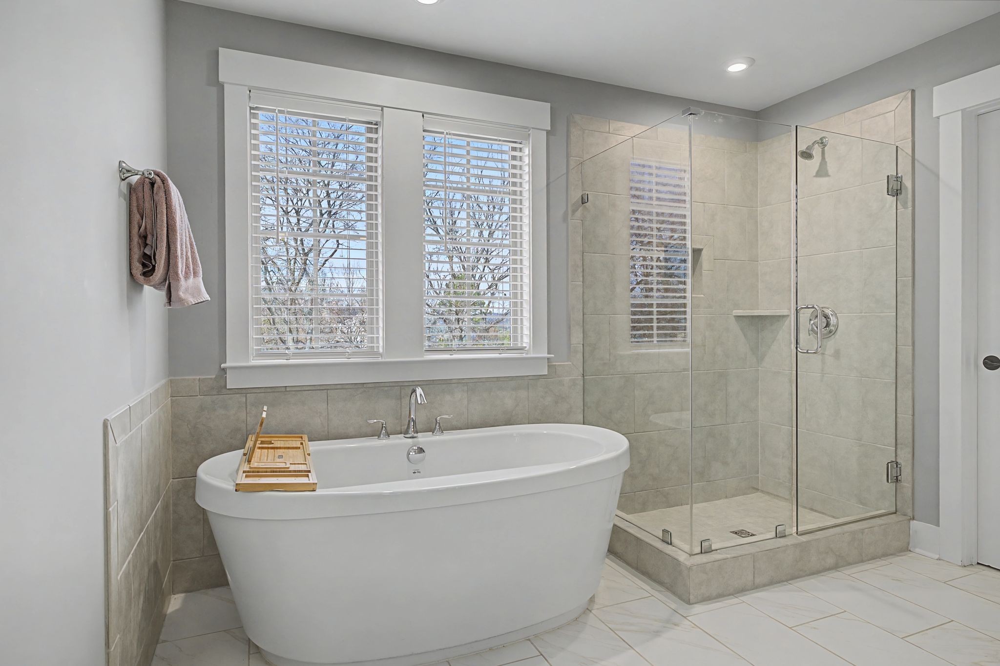 455 Cardel Lane Franklin, TN 37064 - Photo 47 of 54 a white bath tub sitting in a bathroom next to a window