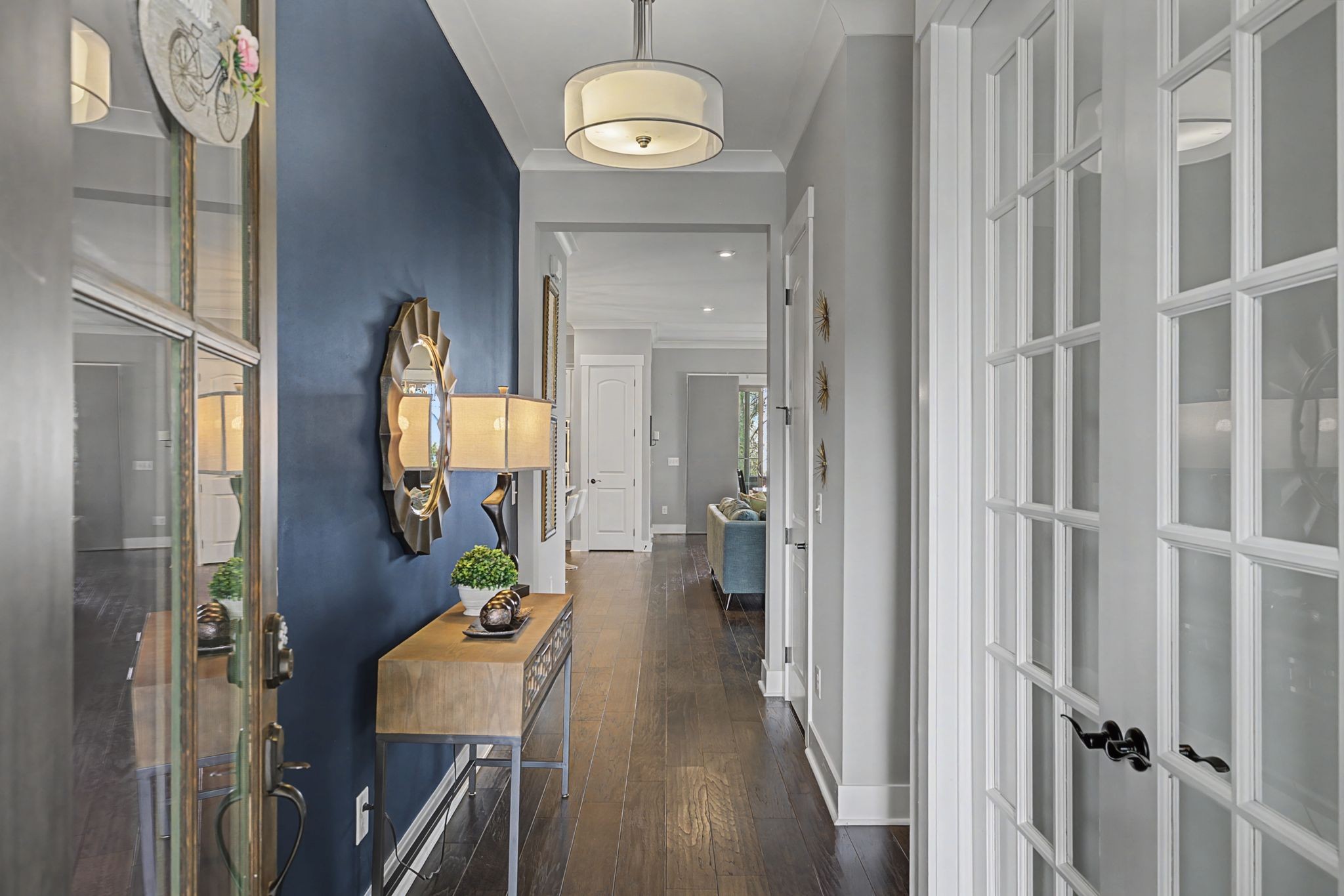 455 Cardel Lane Franklin, TN 37064 - Photo 7 of 54 a view of a hallway with wooden floor and entryway