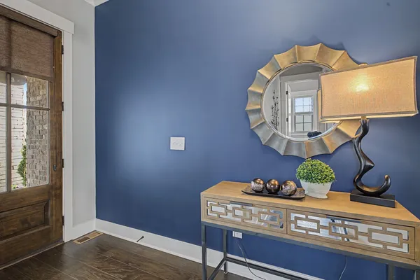 a bathroom with a toilet a sink and a mirror