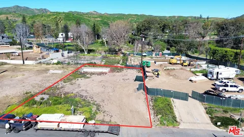 an outdoor space with furniture and a garden