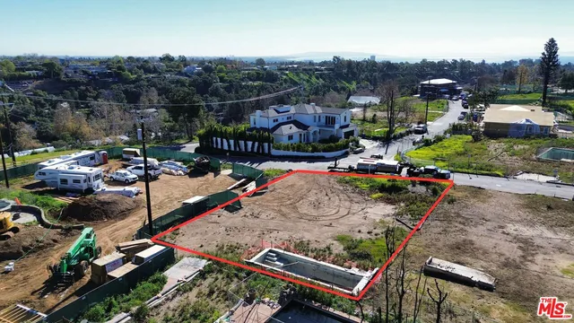 an aerial view of a fireplace with table and chairs