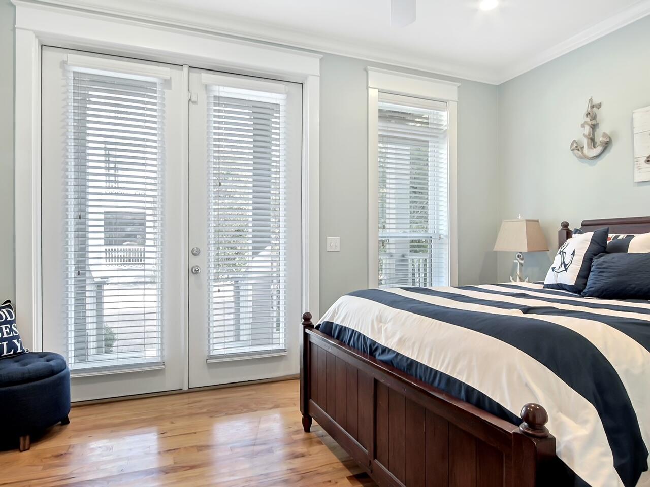 212 Seacrest Beach Boulevard East Inlet Beach, FL 32461 - Photo 14 of 39 a bed sitting in a bedroom next to a window