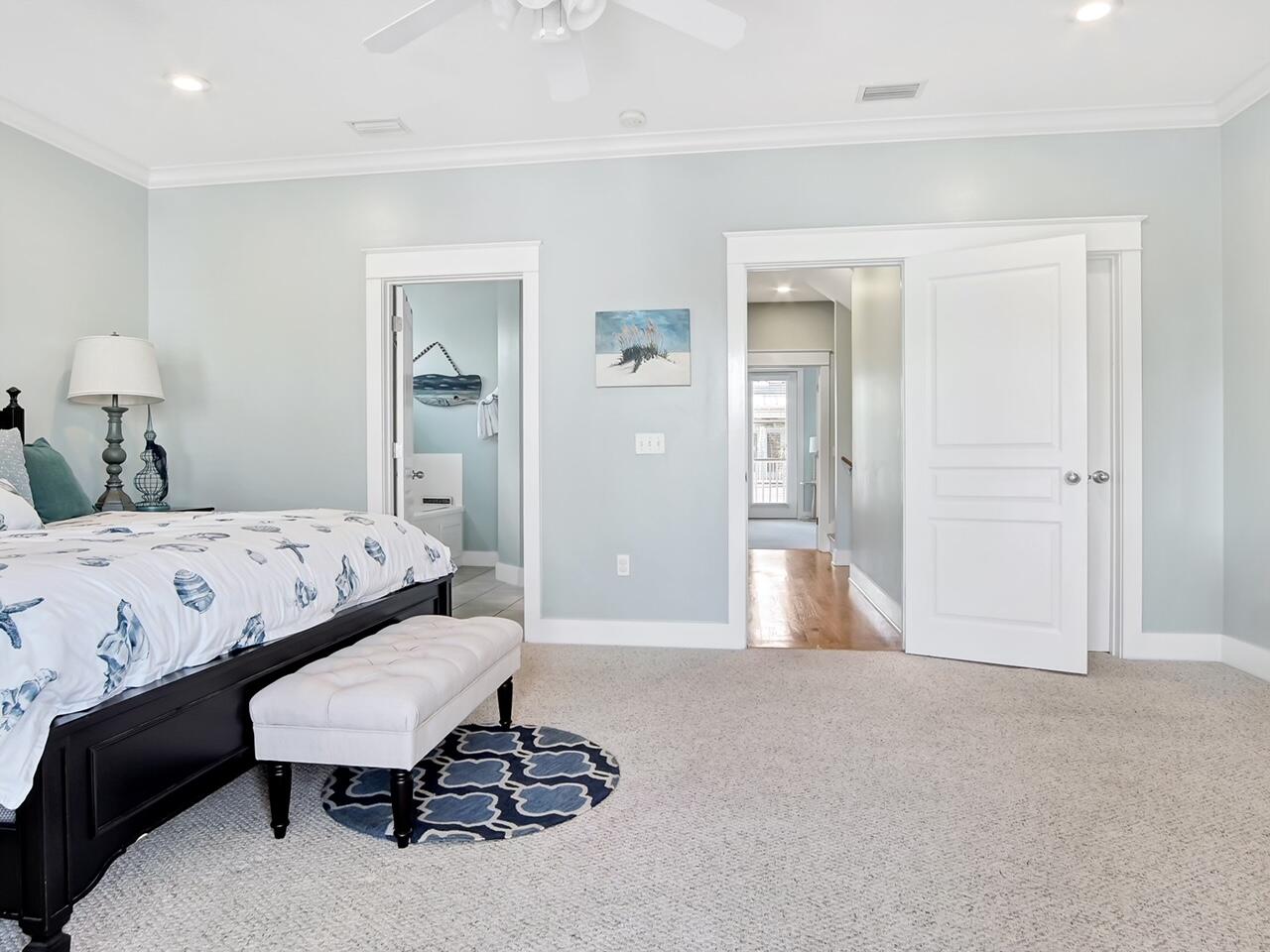 212 Seacrest Beach Boulevard East Inlet Beach, FL 32461 - Photo 16 of 39 a bedroom with a bed and a table in it