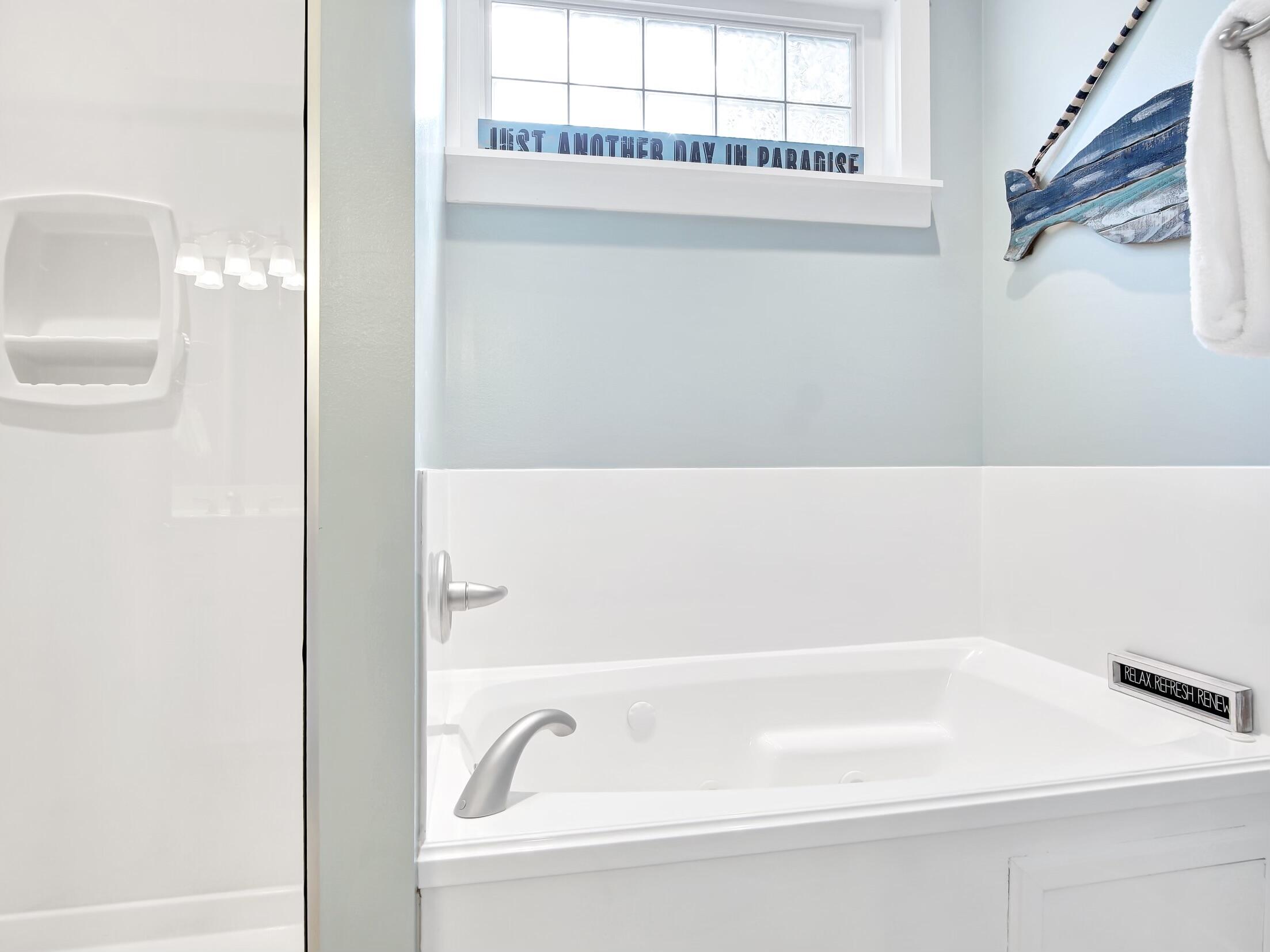 212 Seacrest Beach Boulevard East Inlet Beach, FL 32461 - Photo 18 of 39 a bathroom with a bathtub and a shower