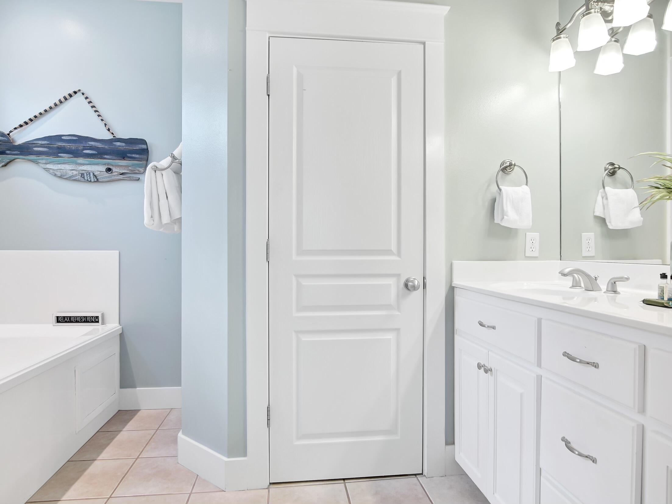 212 Seacrest Beach Boulevard East Inlet Beach, FL 32461 - Photo 19 of 39 a bathroom with a sink a mirror and a shower