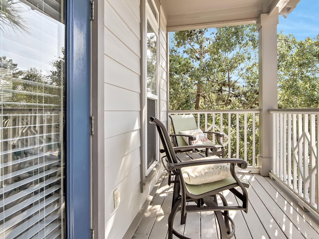 212 Seacrest Beach Boulevard East Inlet Beach, FL 32461 - Photo 22 of 39 a balcony view with a couple of chairs and a table