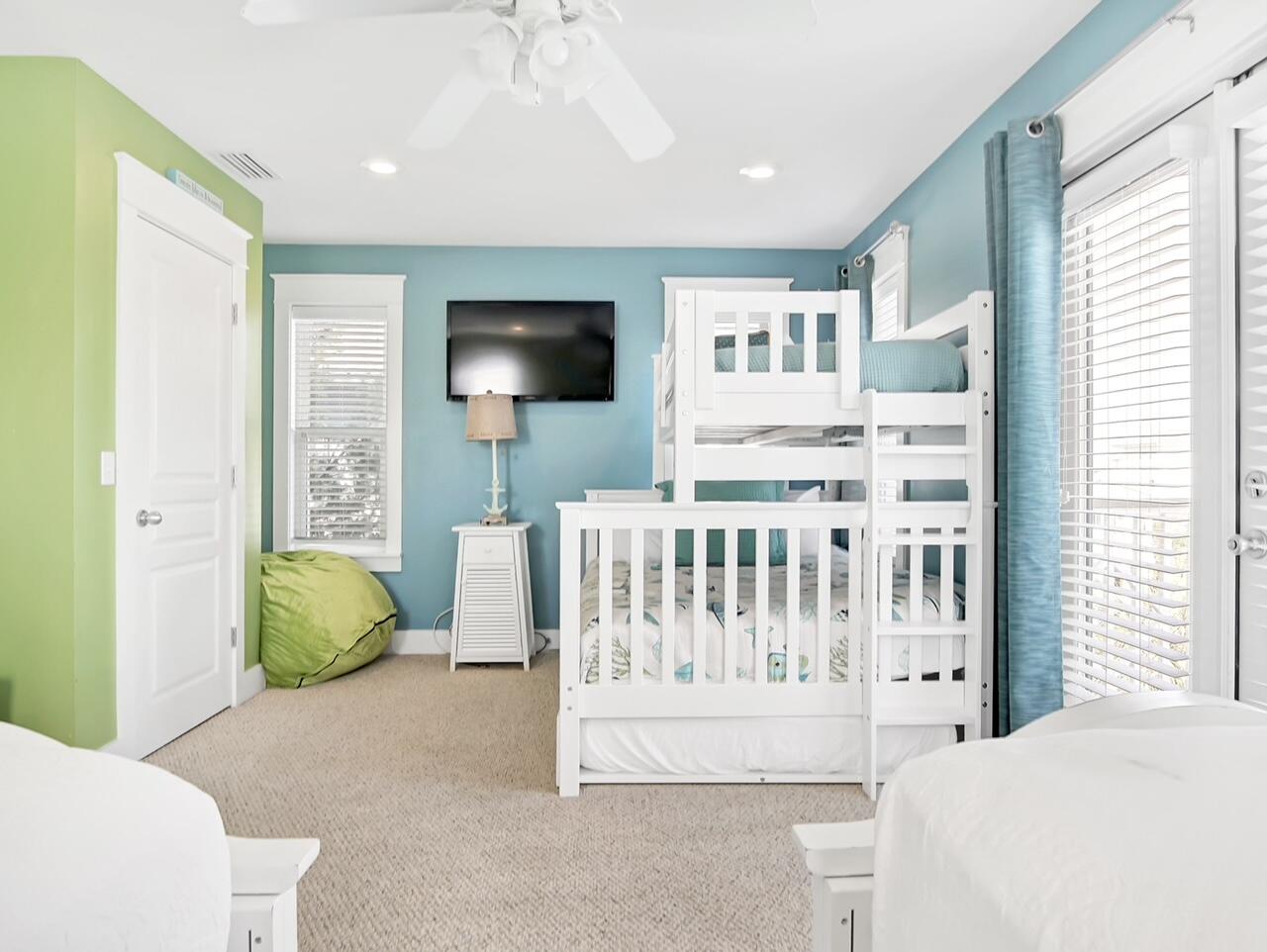 212 Seacrest Beach Boulevard East Inlet Beach, FL 32461 - Photo 25 of 39 a bedroom with furniture and a flat screen tv