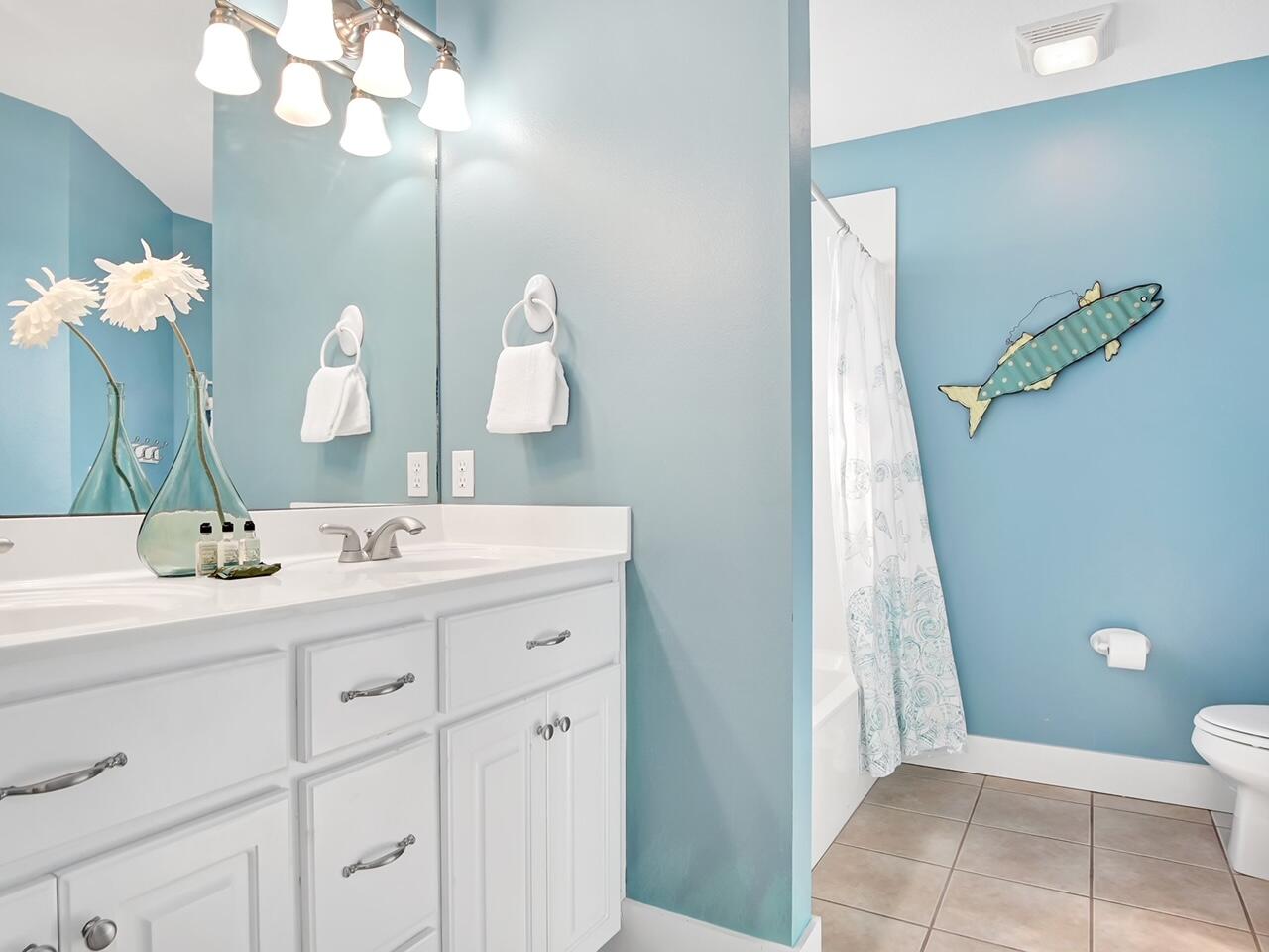 212 Seacrest Beach Boulevard East Inlet Beach, FL 32461 - Photo 26 of 39 a bathroom with a sink a toilet and a mirror