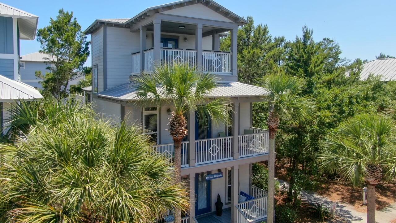 212 Seacrest Beach Boulevard East Inlet Beach, FL 32461 - Photo 3 of 39 a view of a house with brick walls and flower plants