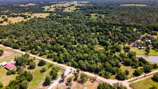 an aerial view of house with yard