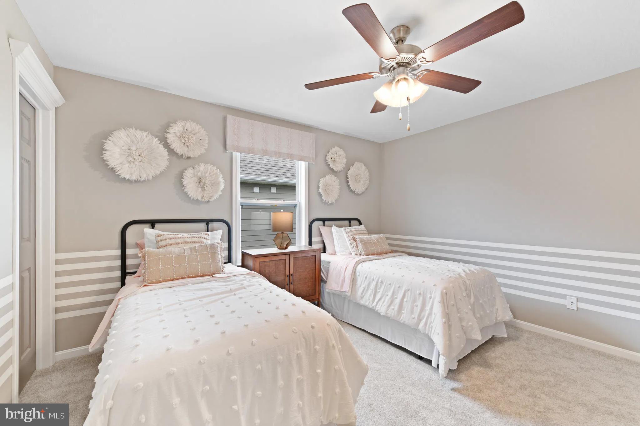 1 Bell Mare Lane Rixeyville, VA 22737 - Photo 12 of 14 a bedroom with two large bed and a chandelier