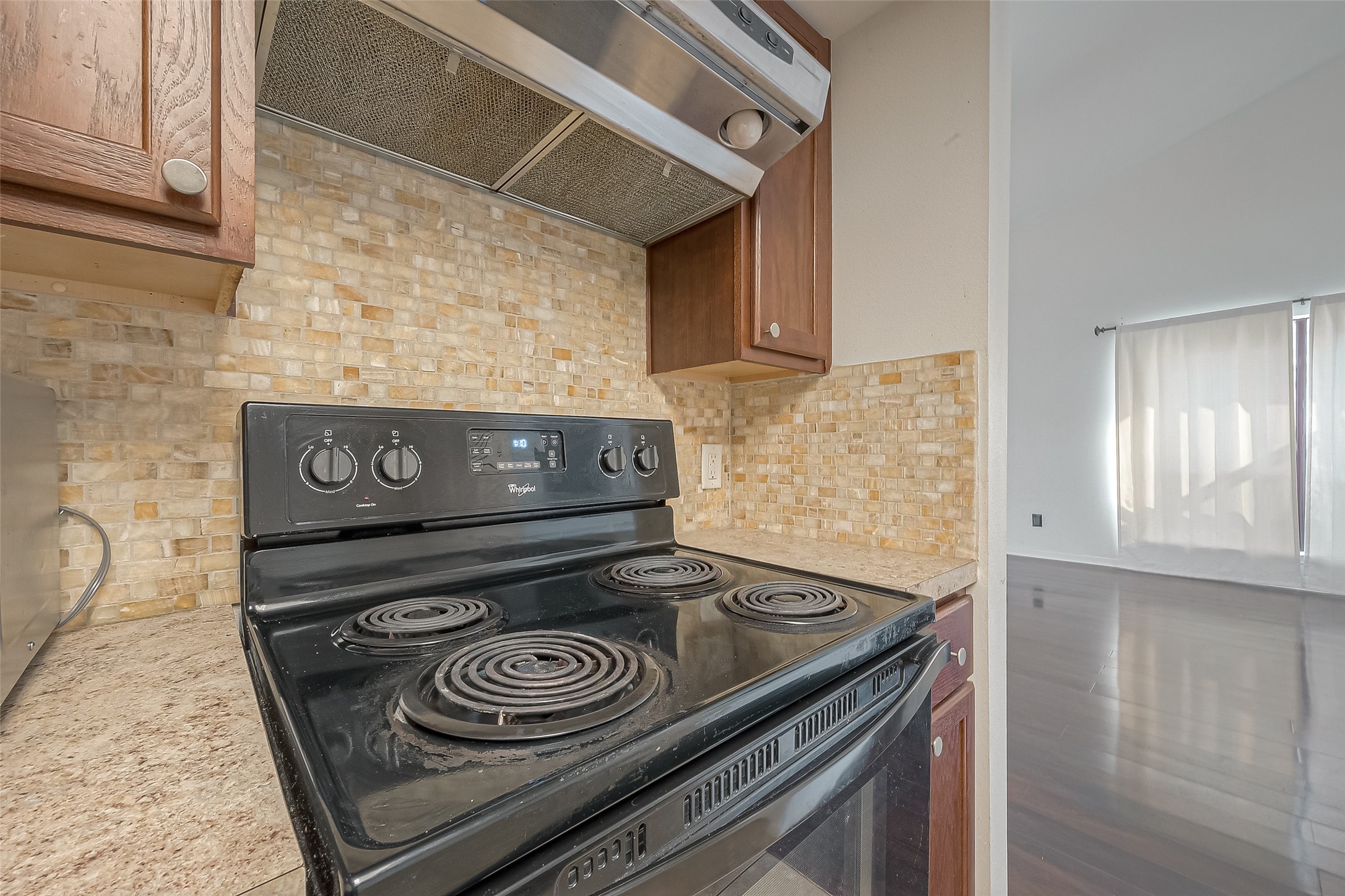 3758 Tanglewilde Street, Unit 2 Houston, TX 77063 - Photo 11 of 28 a stove top oven sitting inside of a kitchen