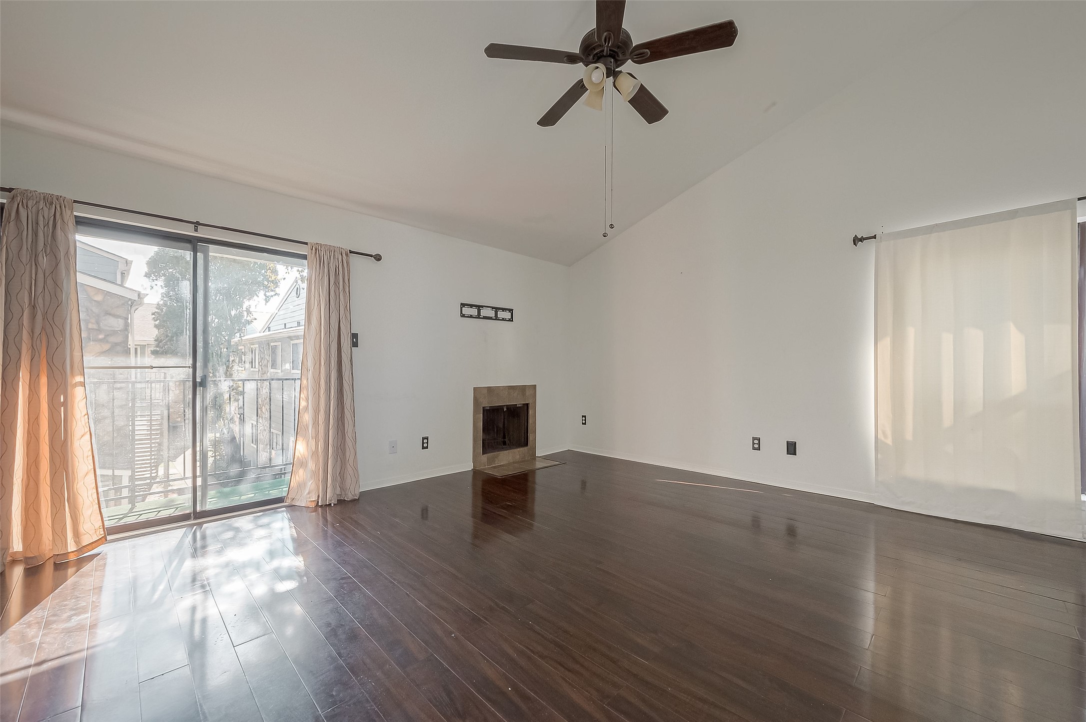 3758 Tanglewilde Street, Unit 2 Houston, TX 77063 - Photo 6 of 28 an empty room with wooden floor fan and windows