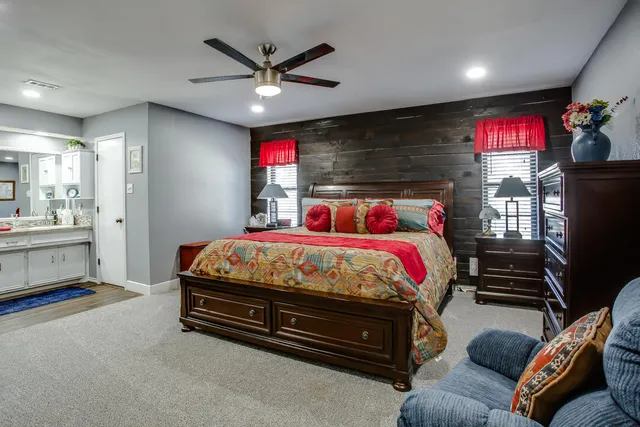 a bed room with a bed and a television