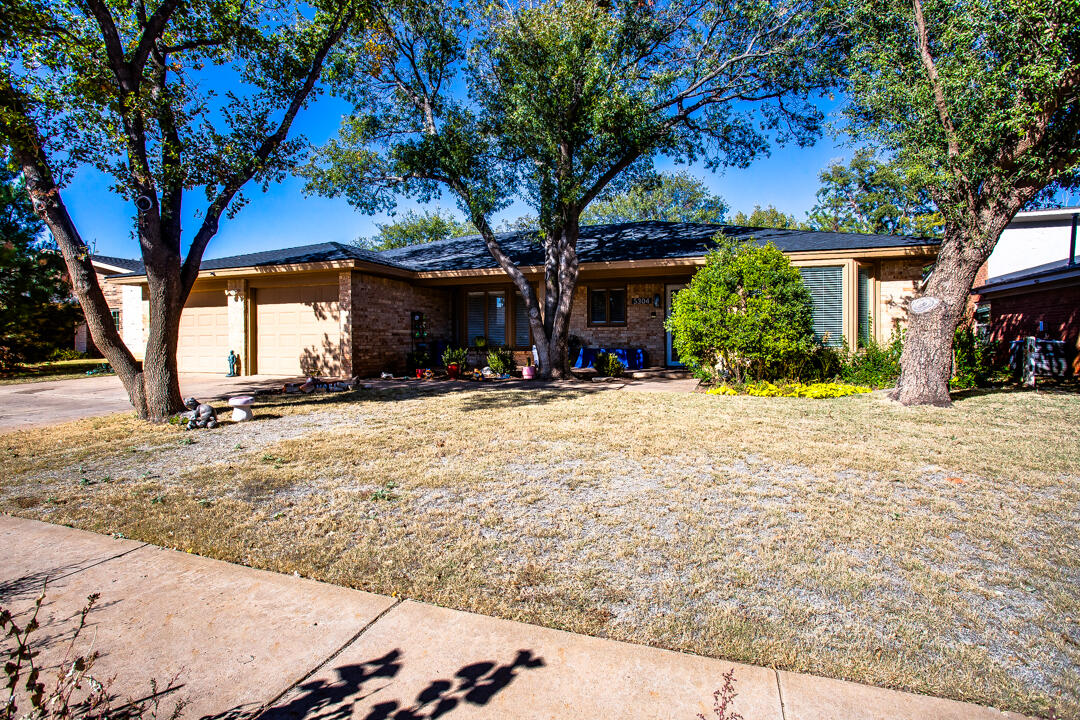 5304 89th Street Lubbock, TX 79424 - Photo 21 of 21 a view of a yard with a tree