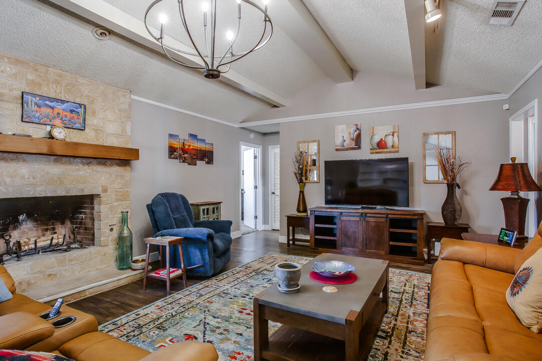 5304 89th Street Lubbock, TX 79424 - Photo 5 of 21 a living room with furniture and a flat screen tv