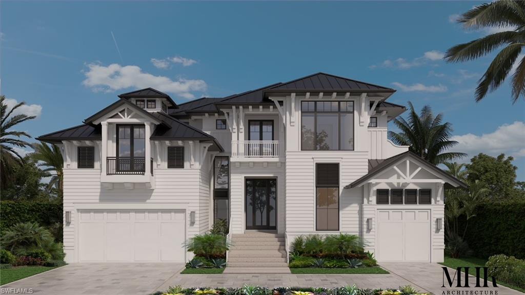 1910 Kingfish Road Naples, FL 34102 - Photo 3 of 11 a front view of a house with a yard