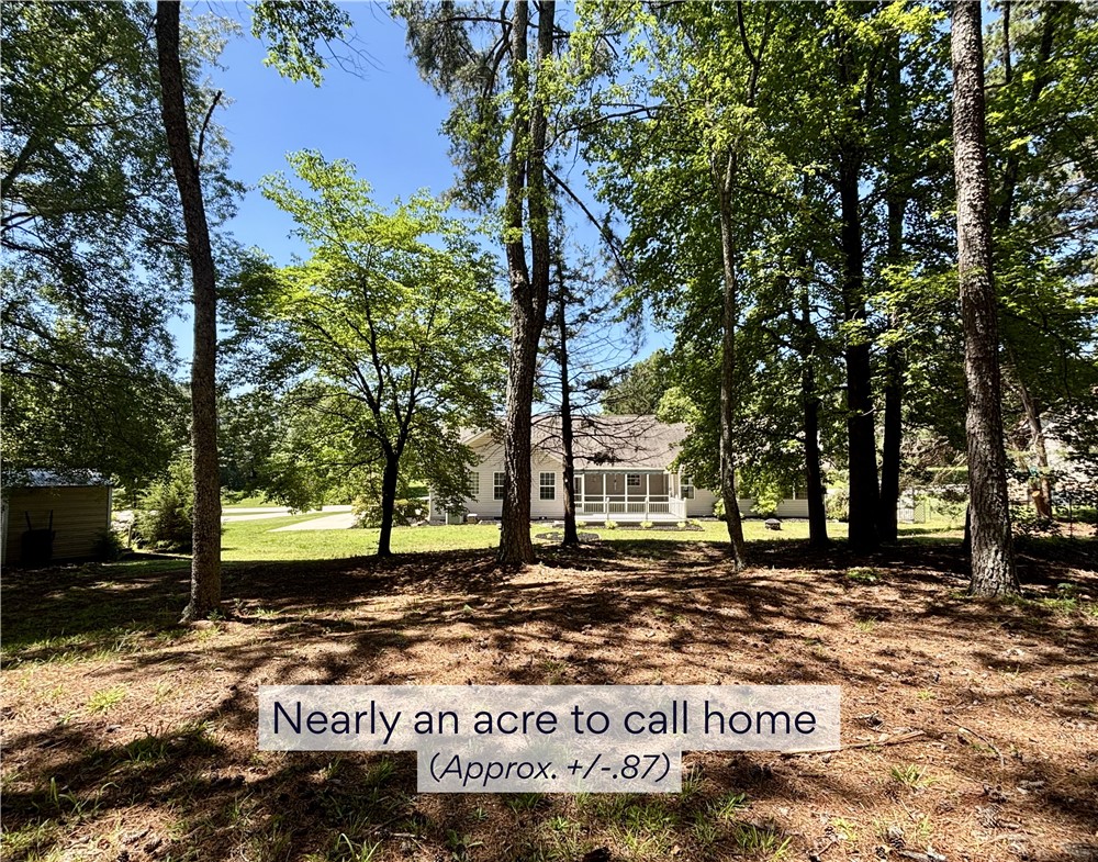 848 Perkins Creek Road Seneca, SC 29678 - Photo 2 of 26 A private wooded setting offers a serene backdrop for this charming residence.