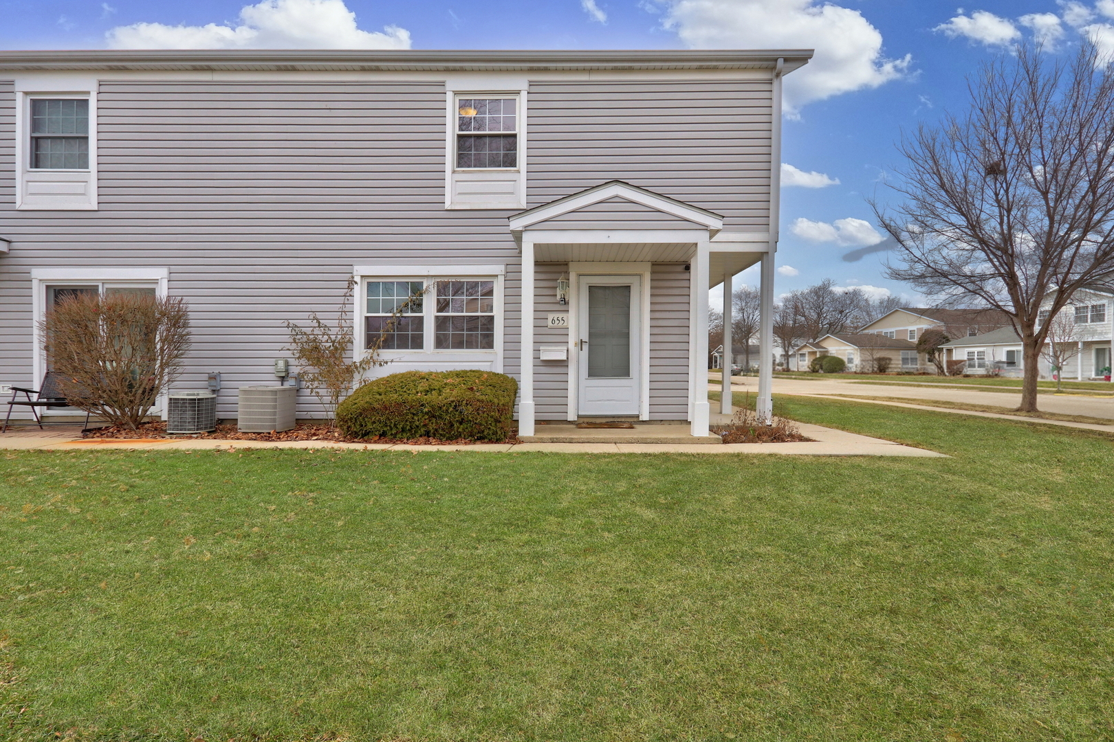 655 Hale Court Wheeling, IL 60090 - Photo 18 of 19 a front view of a house with a yard