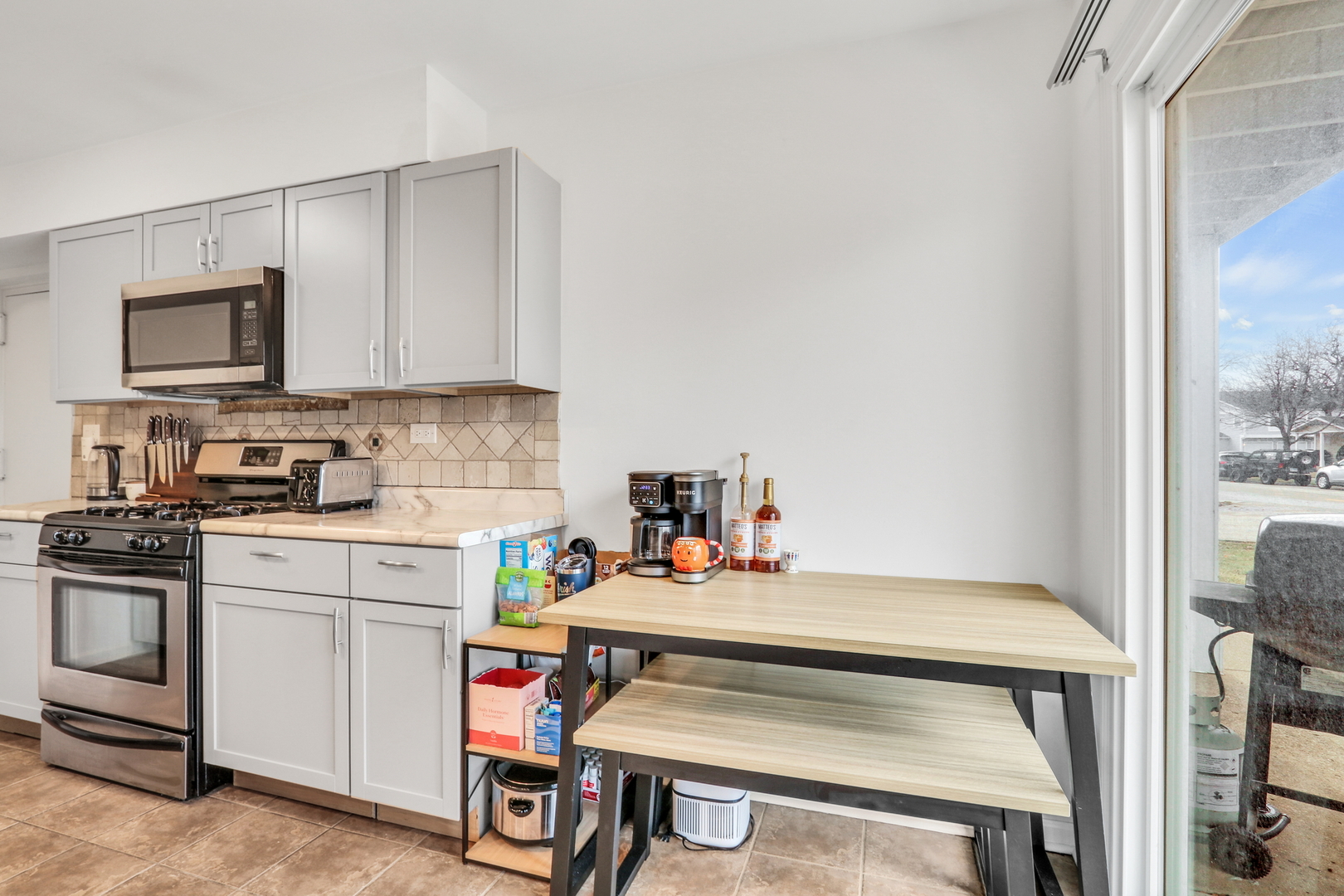 655 Hale Court Wheeling, IL 60090 - Photo 10 of 19 a kitchen with a stove a sink and cabinets