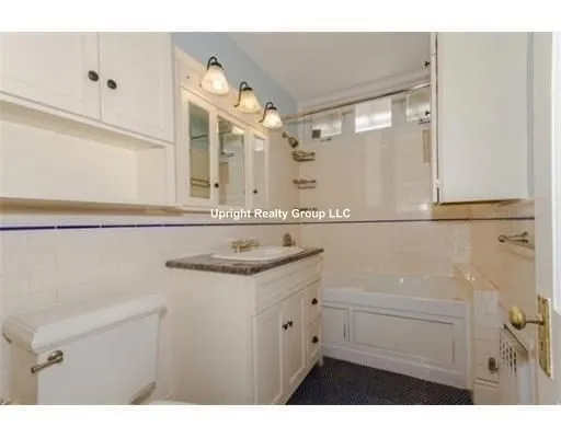 a bathroom with a sink vanity and mirror