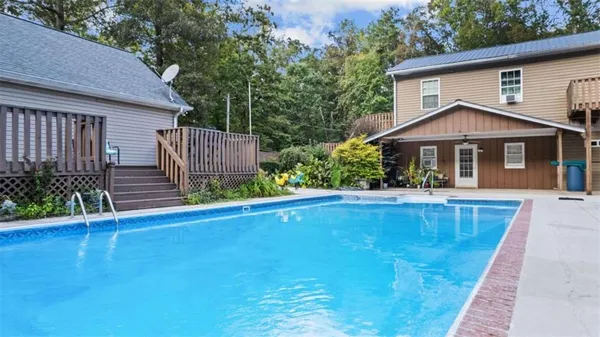 a front view of a house with yard and seating area
