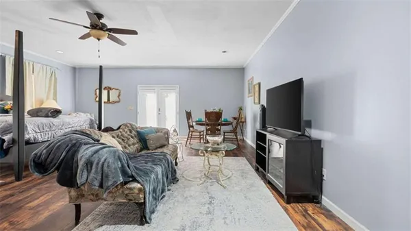 a spacious bedroom with a large bed and a couch