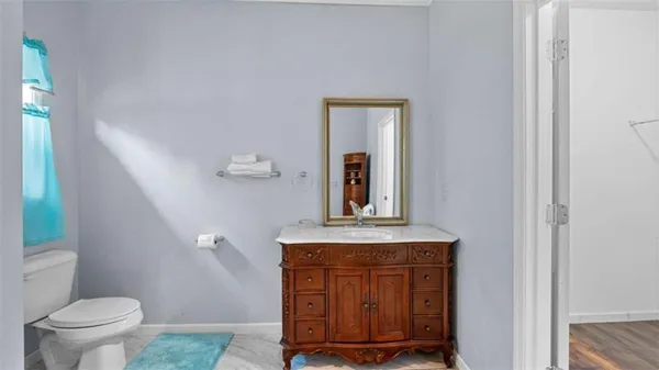 an aerial view of a house with a yard and lake view