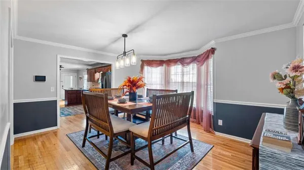 a kitchen with stainless steel appliances granite countertop a refrigerator a stove top oven a sink and dishwasher