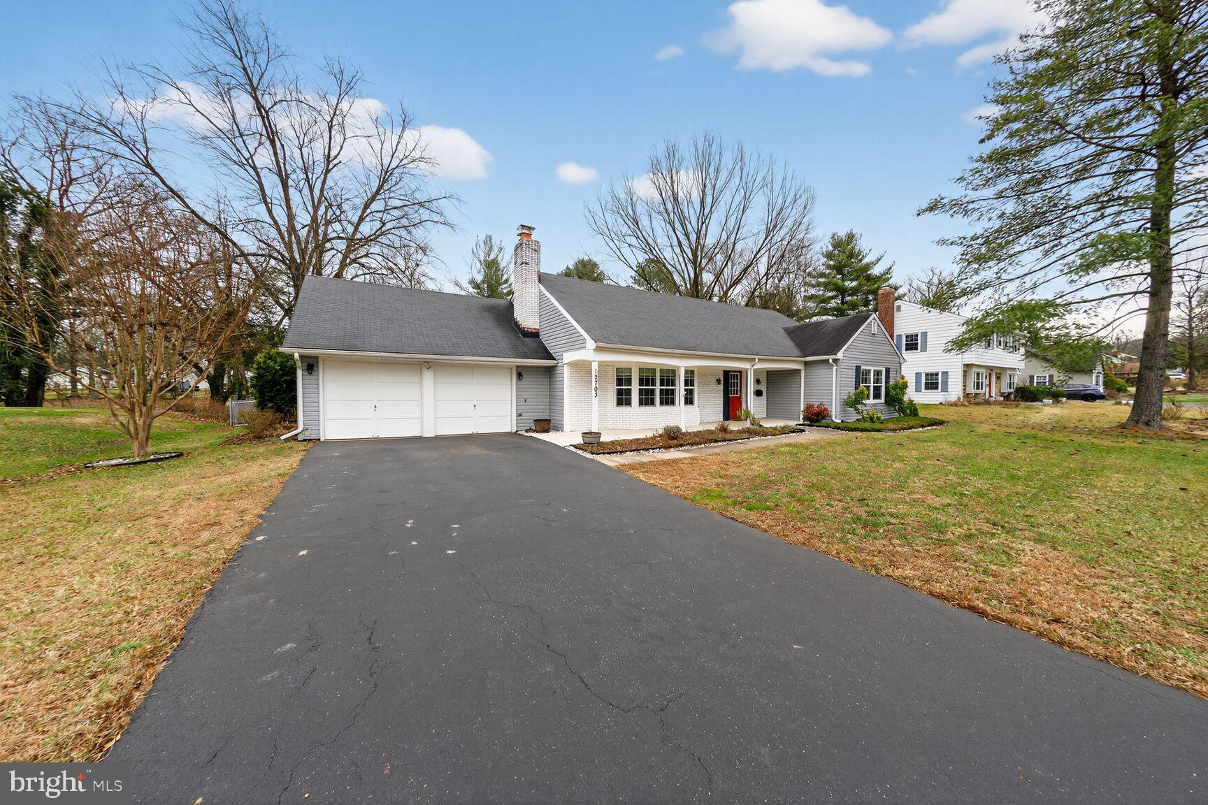 12703 Cedarbrook Lane Laurel, MD 20708 - Photo 2 of 31 a front view of a house with a yard and garage
