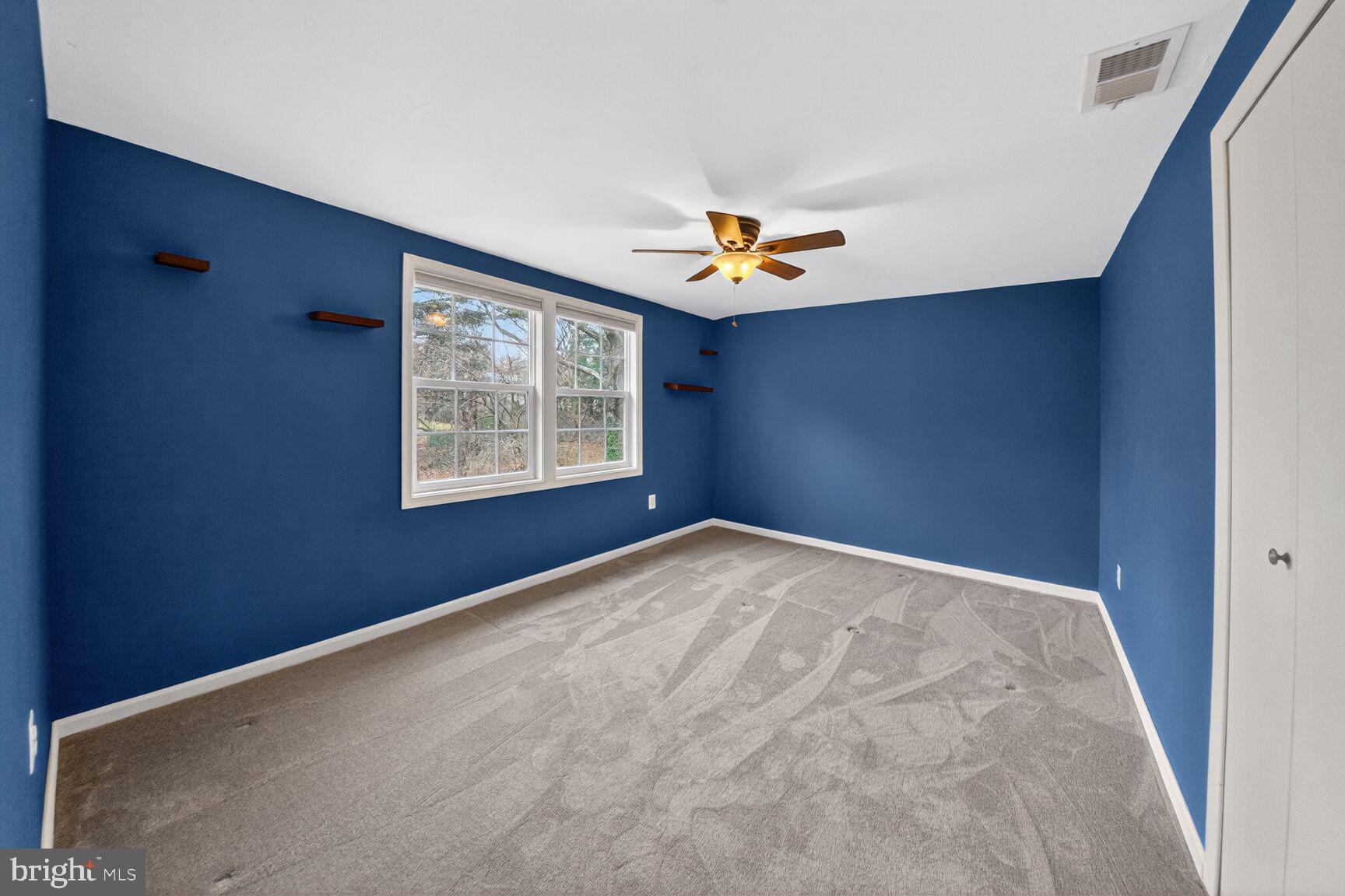 12703 Cedarbrook Lane Laurel, MD 20708 - Photo 23 of 31 an empty room with windows and wooden closet