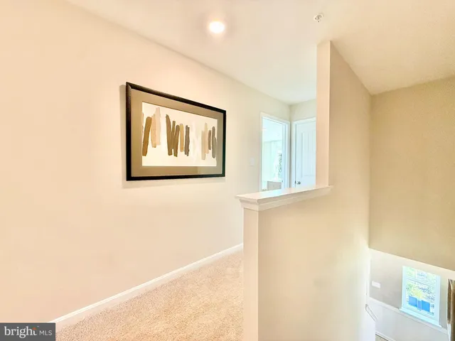 a view of a hallway with front door