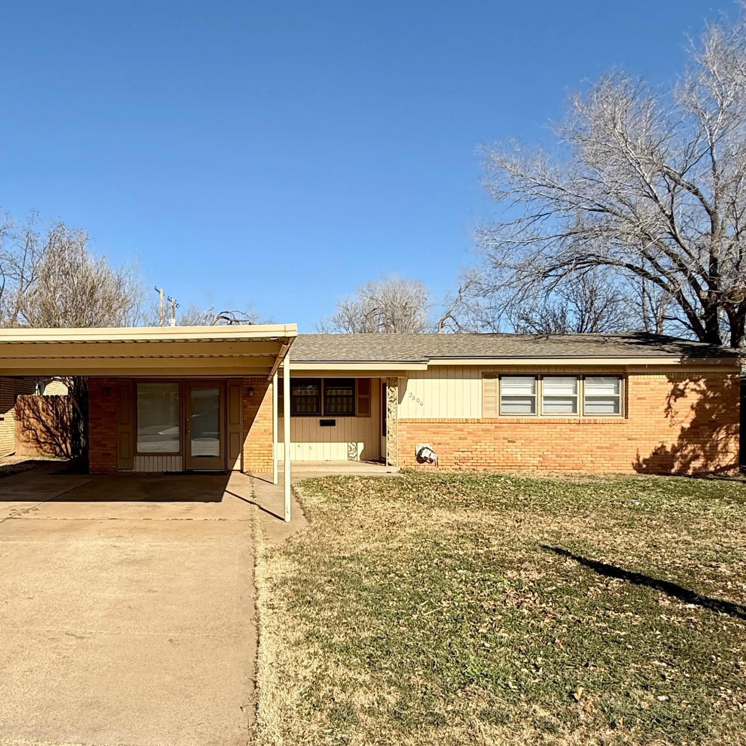2806 54th Street Lubbock, TX 79413 - Photo 1 of 23 a view of a house with a yard