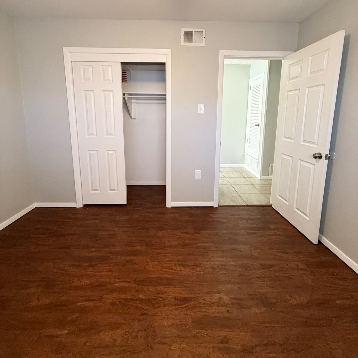 2806 54th Street Lubbock, TX 79413 - Photo 15 of 23 an empty room with wooden floor and closet area